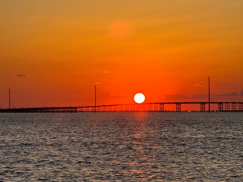 Guests watching the sunset from the boat